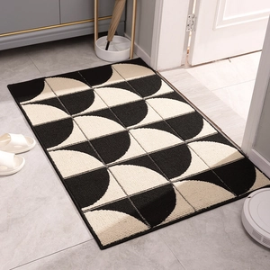 Minimalist black and white geometric entrance mat with non-slip texture for indoor use