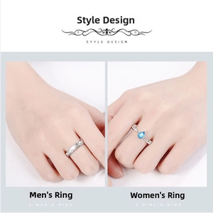 Detail view of silver men's band and women's ring with a blue teardrop stone