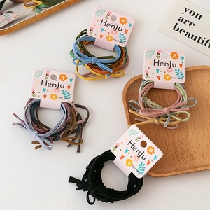 Colorful high elasticity hair tie set with bow knots on floral decorative card packaging