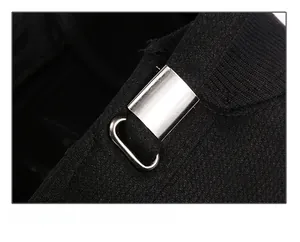 Detail view of adjustable metal buckle on a black winter cap for custom head fit