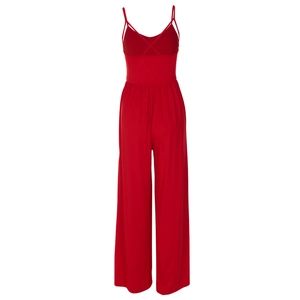 Detail of red wide-leg jumpsuit with thin spaghetti straps and pleated waist design
