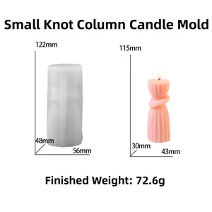 Detailed view of cylindrical knot silicone candle mold with finished pink wax column