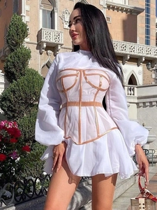 Detailed view of white mesh sleeve dress with nude boned corset waist and tiered skirt
