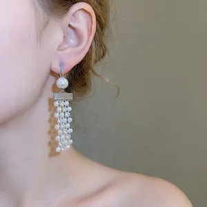 Elegant vintage tassel clip earrings with lustrous pearls and diamonds in silver plating