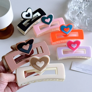 Set of six colorful heart-shaped acetate hair claws for women in various pastel colors