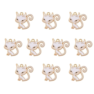 Detailed grid view of ten white cat-shaped alloy charms with gold outlines and s-shaped tails