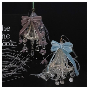 Detail of luxury crystal glass ornaments with velvet bows and soft feathers for decor