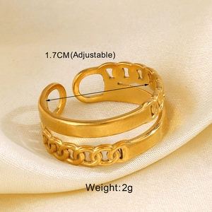 Detail view of gold stainless steel layered heart ring with adjustable opening on silk