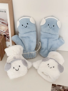 Close-up of thick plush mittens with cute dog ear 3D decor and embroidered smile faces