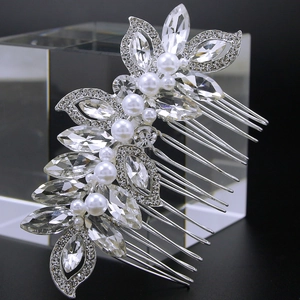 Detailed view of silver hair comb with marquise rhinestones and white pearls on crystals