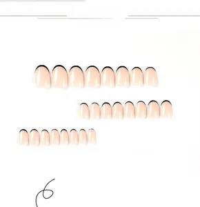 Detail view of 24 pieces short oval press-on nails with black French tips on nude base