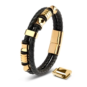 Detail of men's black braided leather bracelet with magnetic gold-plated steel clasps