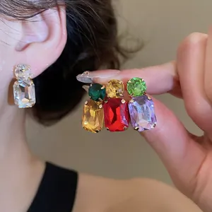 Colorful square crystal drop earrings with round stud accents in vibrant tones