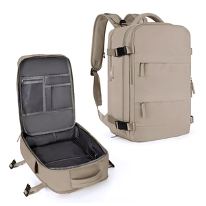 Detail view of khaki travel backpack showing large capacity and internal mesh pockets