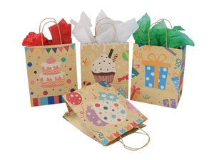 Detail of kraft paper gift bags with cake patterns and colorful tissue paper inserts