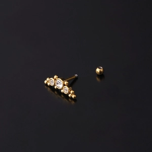 Golden fan-shaped cartilage stud with sparkling crystals and screw ball back earring