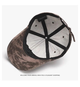 Detail of internal six-panel structure and adjustable metal buckle on washed baseball cap