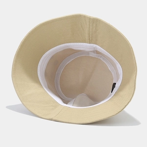 Detail view of khaki cotton bucket hat interior with sweatband and quality stitching