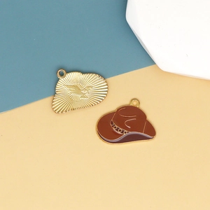 Detail of alloy cowboy hat and bird cloud charms for DIY jewelry making and keychains