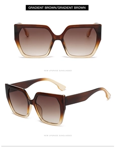 Macro detail of gradient brown oversized sunglasses showing premium frame and smooth texture