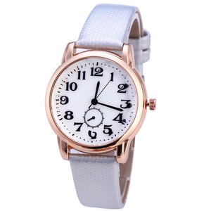 Detail of rose gold alloy case and white honeycomb texture leather strap on quartz watch