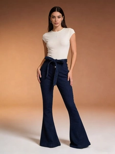 Detail of high waisted flare jeans with lace-up waist and ribbed short sleeve top