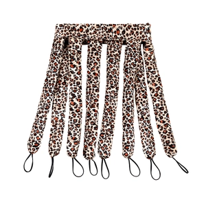 Macro detail of octopus style leopard print heatless hair curler with elastic bands