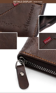 Detailed close-up of dark brown lychee leather texture and orange stitching on men's wallet