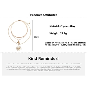Detailed view of layered gold necklace set with sun and starfish pendants including dimensions