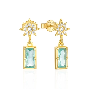 Macro view of S925 gold plated star earrings featuring light blue square crystals