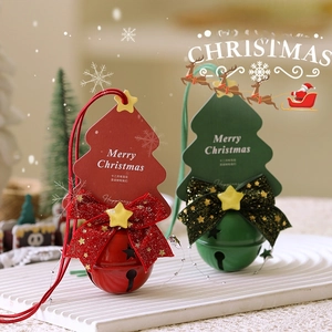 Christmas tree bells with star cutouts, festive cards and glittery bows for holiday decor