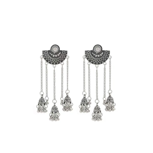 Vintage silver Bohemian tassel earrings with floral engraving and bell charms on white back
