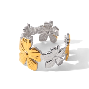 Detail of two-tone flower ring with silver and gold petals in polished stainless steel