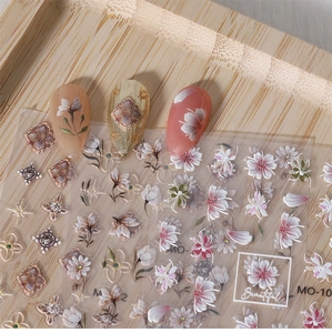 Detail of 5D embossed nail art stickers with vintage tulip and rabbit floral patterns