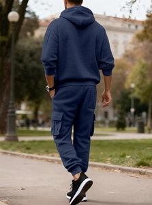 Rear view of navy blue men's tracksuit set with hoodie and cargo jogger pants detail