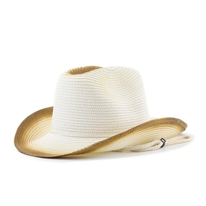 Close-up of woven straw cowboy hat featuring brown gradient brim and windproof rope