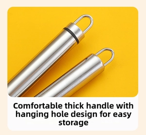 Macro view of stainless steel corn peeler handles with functional hanging hook design