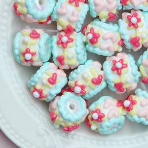 Detailed macro view of colorful floral cake resin beads for DIY jewelry making and crafts