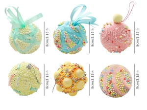 Close-up of 8cm macaron Christmas baubles with beads, glitter, and ribbon textures