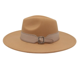 Detailed view of camel wool fedora hat featuring a wide brim and buckled leather band