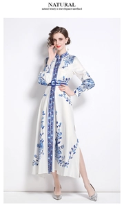 Detailed view of white floral maxi dress featuring a high collar and side slit detail