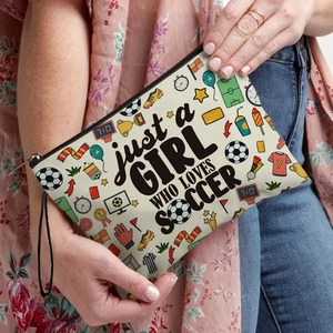 Soccer themed makeup bag for girls with soccer ball prints and zipper closure