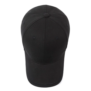 Minimalist black cotton baseball cap for men featuring a six-panel breathable structure