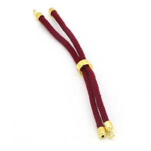 Close-up of deep red braided cord with adjustable gold metal sliders and hooks