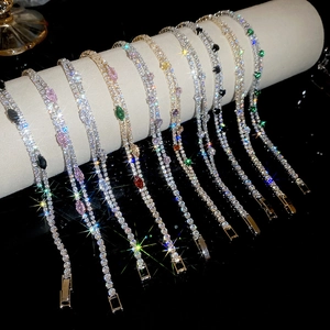 Detailed macro view of 18k gold plated double-layer bracelets with sparkling zircons