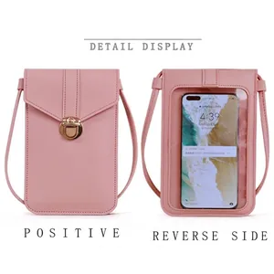 Pink touch screen mini crossbody phone bag with gold buckle and transparent back window