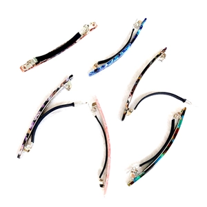 Set of six 10cm French tortoise shell and marble acetate hair clips on white background