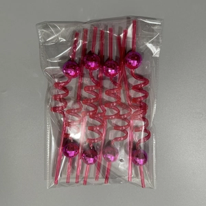 Set of 4 pink spiral disco ball straws in protective clear plastic packaging