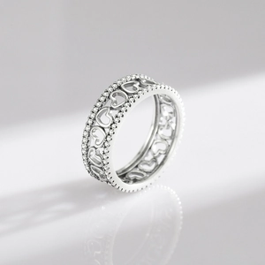 Vintage S925 sterling silver hollow heart ring with sparkling crystal inlay on white background