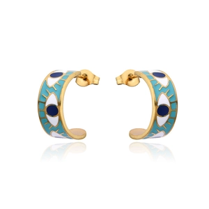 Detail view of golden Evil Eye hoop earrings with blue enamel finish on white background